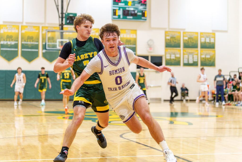 Rumson at RBC - Shore Sports Insider Rumson-Fair Haven senior Luke Lydon (0) and Red Bank Catholic junior Gavin Biasi chase after a loose ball. (Photo: Patrick Olivero) - Rumson at RBC