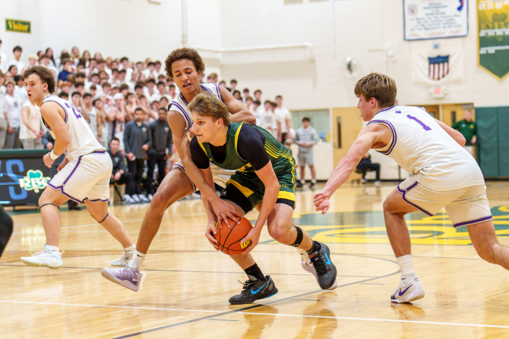 Red Bank Catholic junior Gavin Biasi defended by Rumson-Fair Haven freshman Clint Martin. (Photo: Patrick Olivero) - Rumson at RBC