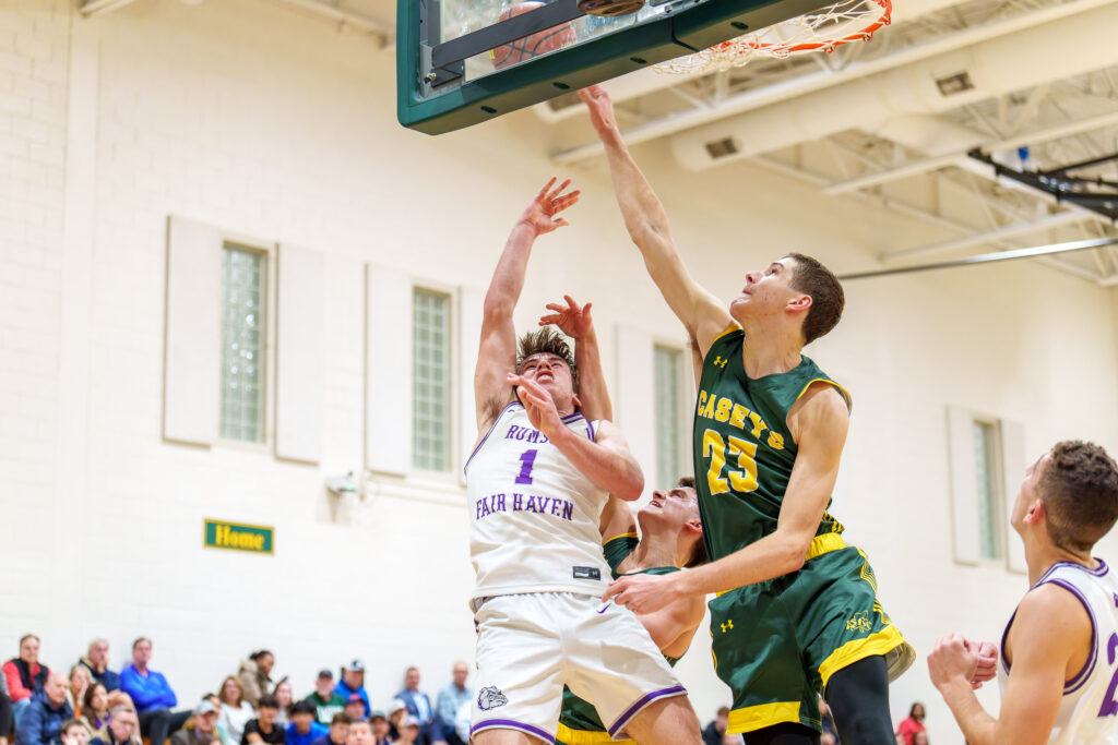 Rumson at RBC - Shore Sports Insider Red Bank Catholic junior Tyler Hager blocks a shot by Rumson-Fair Haven junior Casey Moore. (Photo: Patrick Olivero) - Rumson at RBC