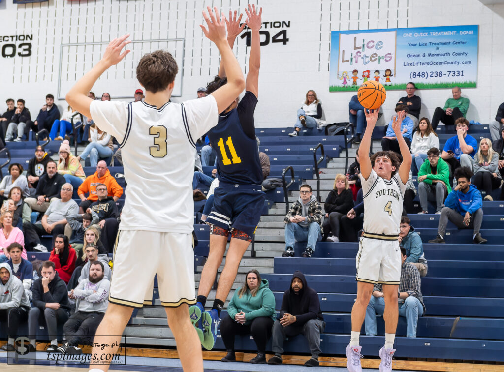 TRN vs Southern - Shore Sports Insider Southern junior Anthony Buczynski fires up a shot over oncoming Toms River North junior Jackson Sias as Southern junior Gavin Gerckens (3) looks on. (Photo: Tom Smith | tspsportsimages.com) - TRN vs Southern