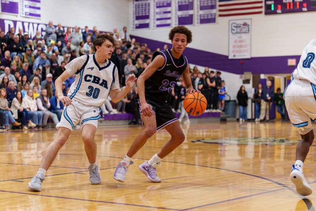 Rumson-Fair Haven freshman Clint Martin shadowed by CBA senior Matt Veisz. (Photo: Patrick Olivero) - CBA at Rumson