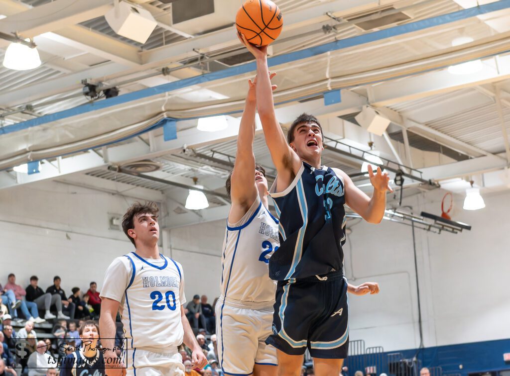 CBA senior Connor Andree puts up a shot with Holmdel senior Jack Cannon and senior Dylan Zammit looking on. (Photo: Tom Smith | tspsportsimages.com) - CBA vs Holmdel