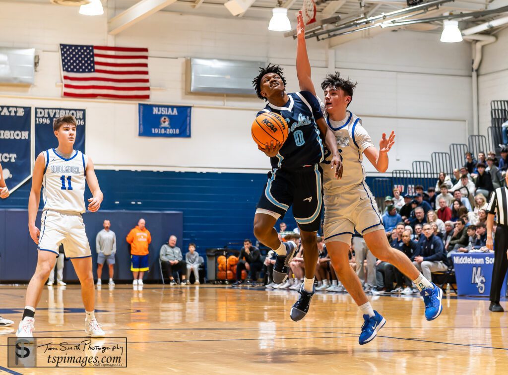 CBA vs Holmdel - Shore Sports Insider CBA sophomore Izayah Cooper drives past Holmdel senior Jack Cannon. (Photo: Tom Smith | tspsportsimages.com) - CBA vs Holmdel