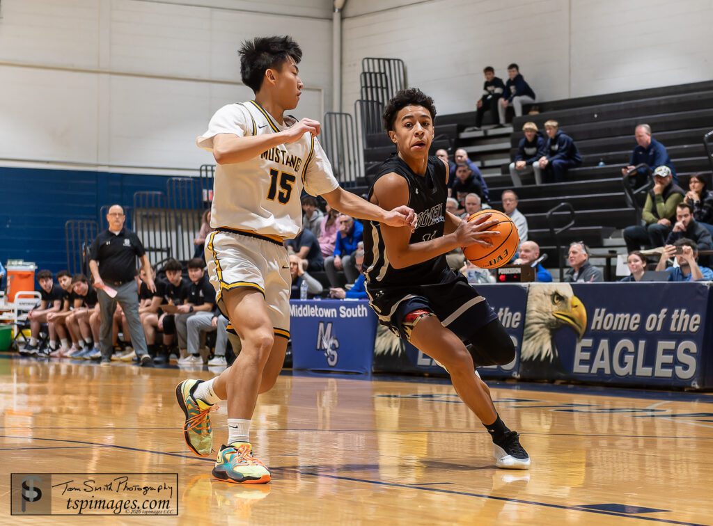 Howell junior Jayson Parker defended by Marlboro junior Nolan Gon. (Photo Credit: Tom Smith | tspsportsimages.com) - Howell's Jayson Parker