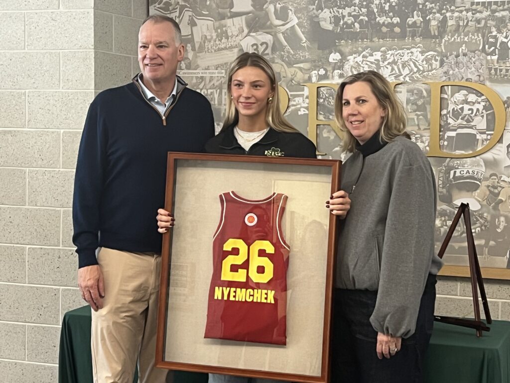 Addy Nyemchek with her McDonald's All-American jersey and parents, Brian and Heidi Nyemchek. (Photo: Matt Manley) - Nyemchek All-American
