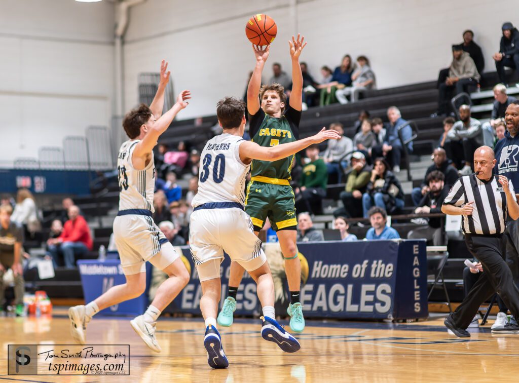 Red Bank Catholic junior Gavin Biasi shoots over Ranney defenders A.J. Mizhir (Ranney) and Ben Schaeffer. (Photo: Tom Smith | tspsportsimages.com) - RBC vs Ranney