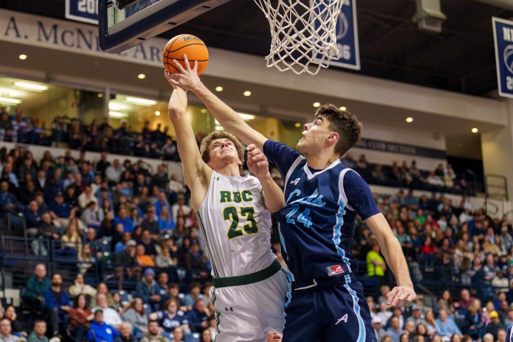 CBA junior David Buley challenges a shot by Red Bank Catholic junior Tyler Hager. (Photo: Patrick Olivero) - CBA vs RBC SCT