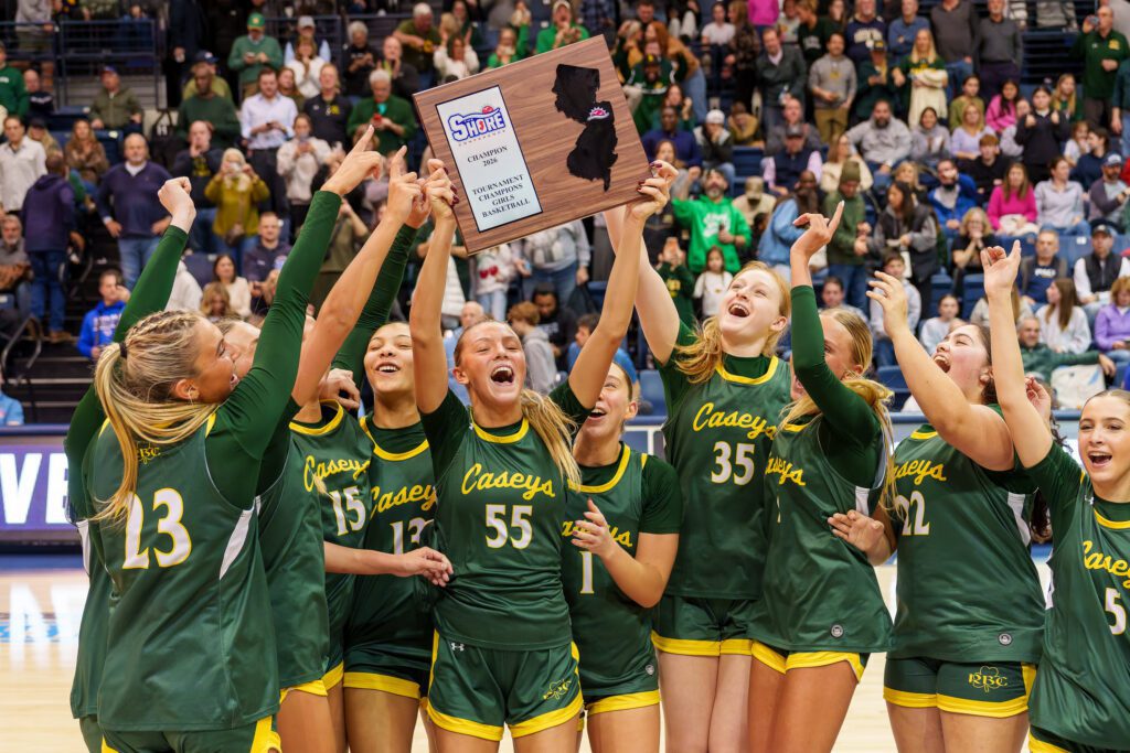 RBC SCT Champs - Shore Sports Insider Red Bank Catholic's Addy Nyemchek (55) raises the Shore Conference Tournament championship plaque. (Photo: Patrick Olivero) - RBC SCT Champs