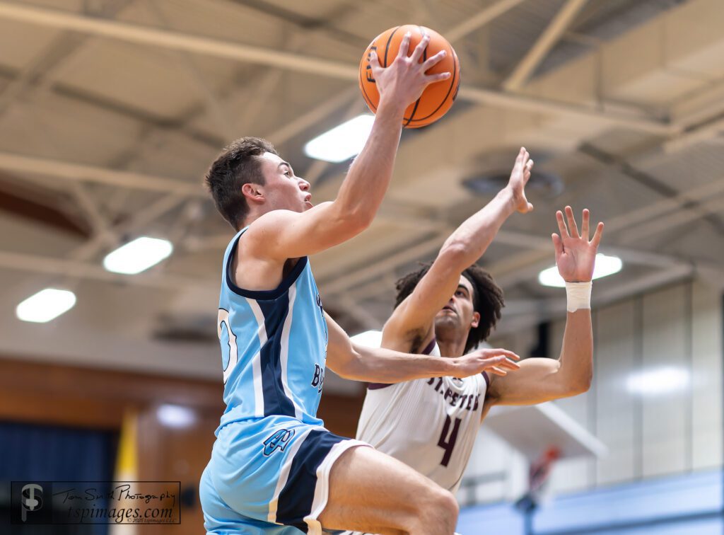 CBA senior Charlie Messano goes up for a layup against St. Peter's senior Derek Gomez. (Photo: Tom Smith | tspsportsimages.com) - CBA vs SPP