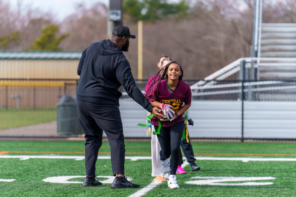 New York Giants All-Pro Left Tackle Andrew Thomas helps a Central Regional player work on receiving hand-offs (Photo by Patrick Olivero) - Andrew Thomas Giants