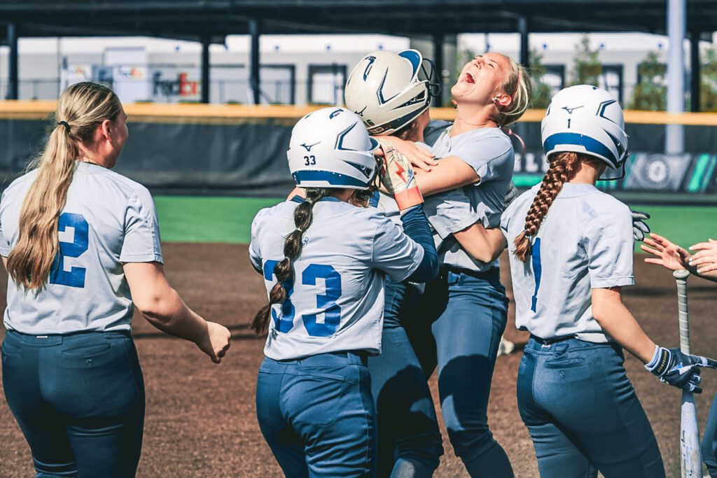 Riley Smith hugging Nora Sarcone after the walk-off insider the park home run by Sarcone. 4/18/26 Photo by Samantha Mayer - 1G0A9868