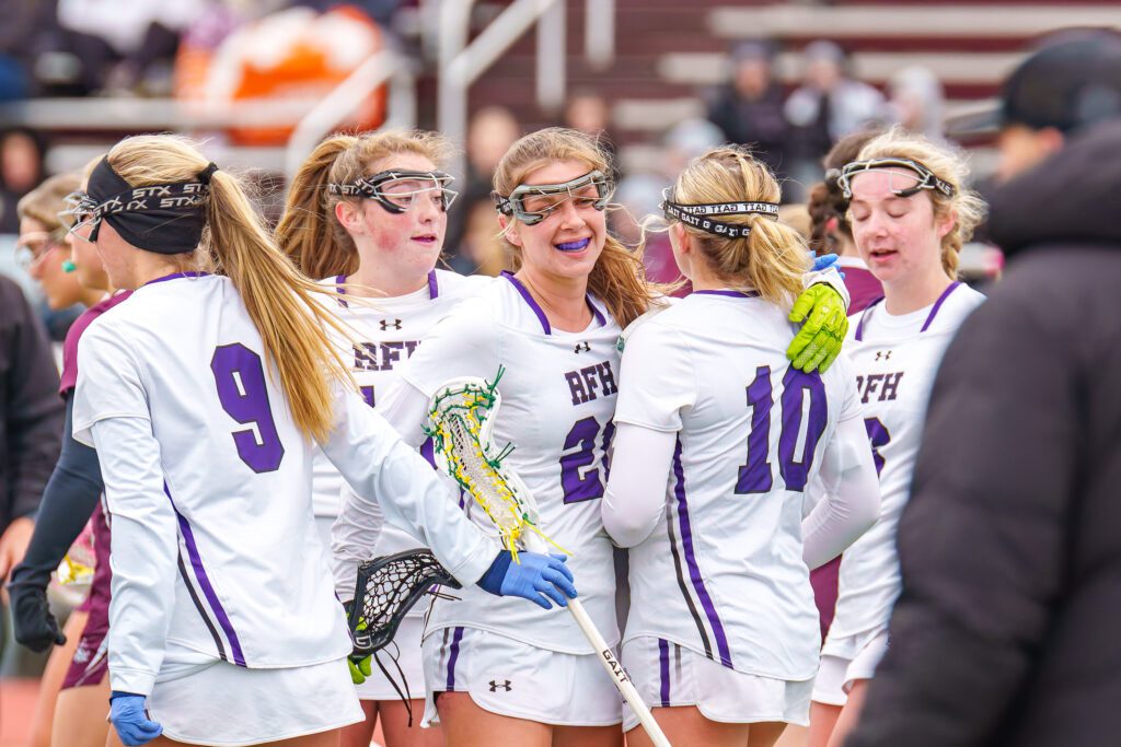 Rumson-Fair Haven's Celia Benedetto (#21) celebrates with her teammates (Photo by Patrick Olivero) - SSI_Girls_Lacrosse_RFH_v_RBR_4-2-26_Samples-20 1