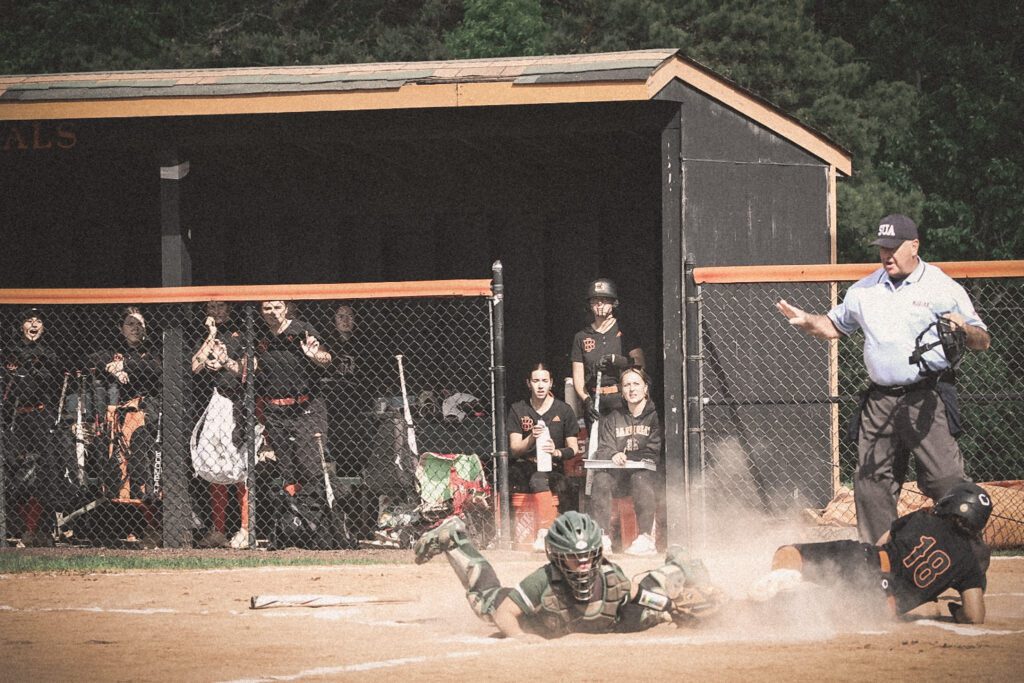 Barnegat's Riley Schmidt sliding into home for her first run of the game (Photo by SidelineSamsShots) - Barnegat Riley Schmidt