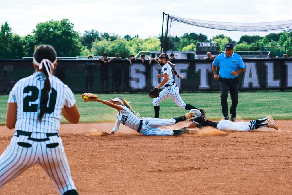 Colts Neck's Gabby Bryce dives to make a play at second base (Photo by SidelineSamsShots) - Colts Neck Gabby Bryce